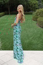 Beaded floral prom gown featuring delicate straps and high slit