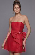 Radiant red evening dress with a classic strapless silhouette and an architectural bow accent on the front.