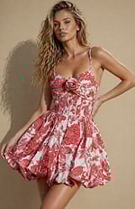 High-waisted bubble hem dress with a vintage-inspired rose pattern and modern sheer corset detailing.