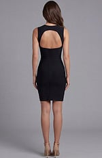 Fitted dress with asymmetric neckline and floral shoulder accent