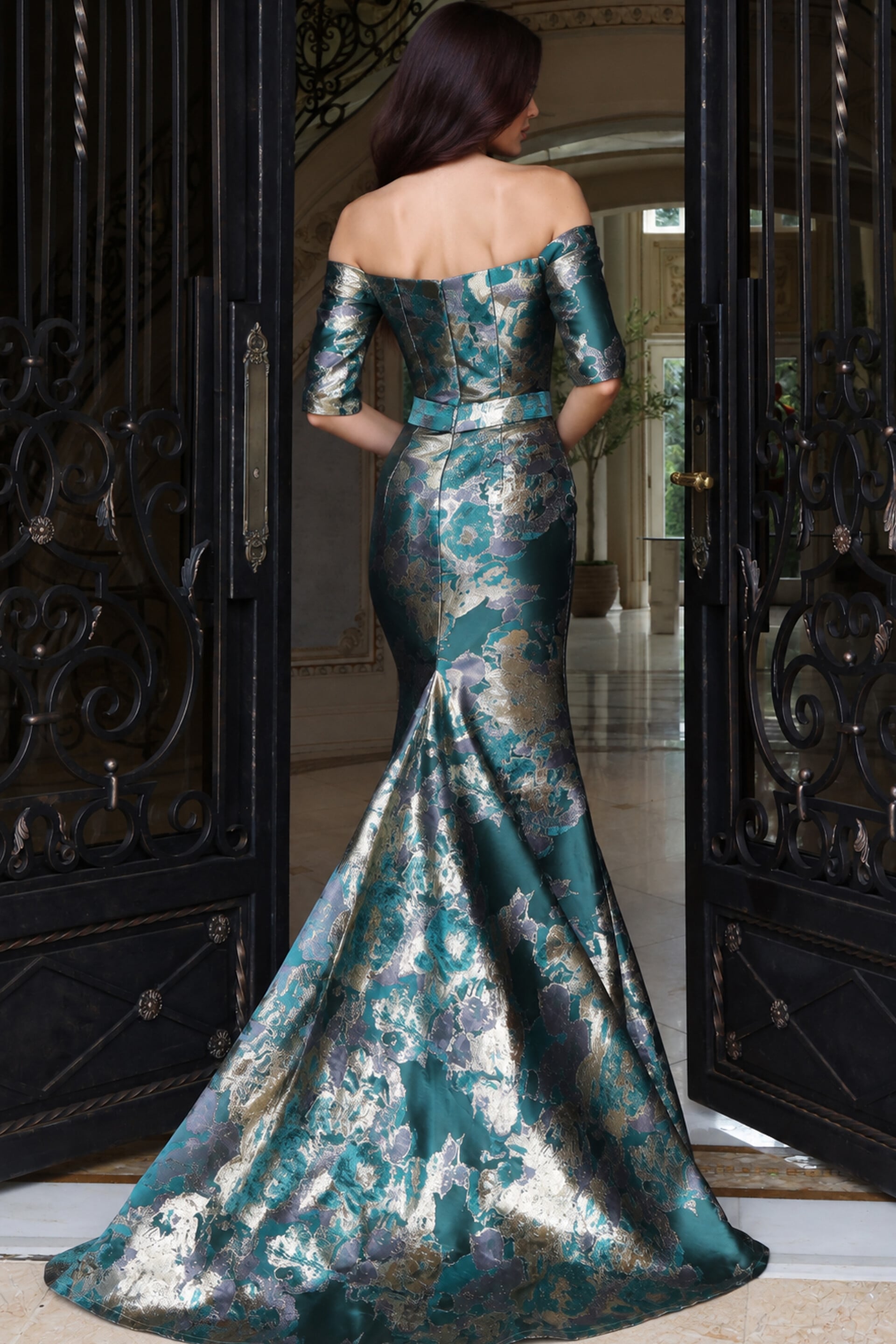 Teal and gold metallic jacquard off-the-shoulder mermaid gown, back view