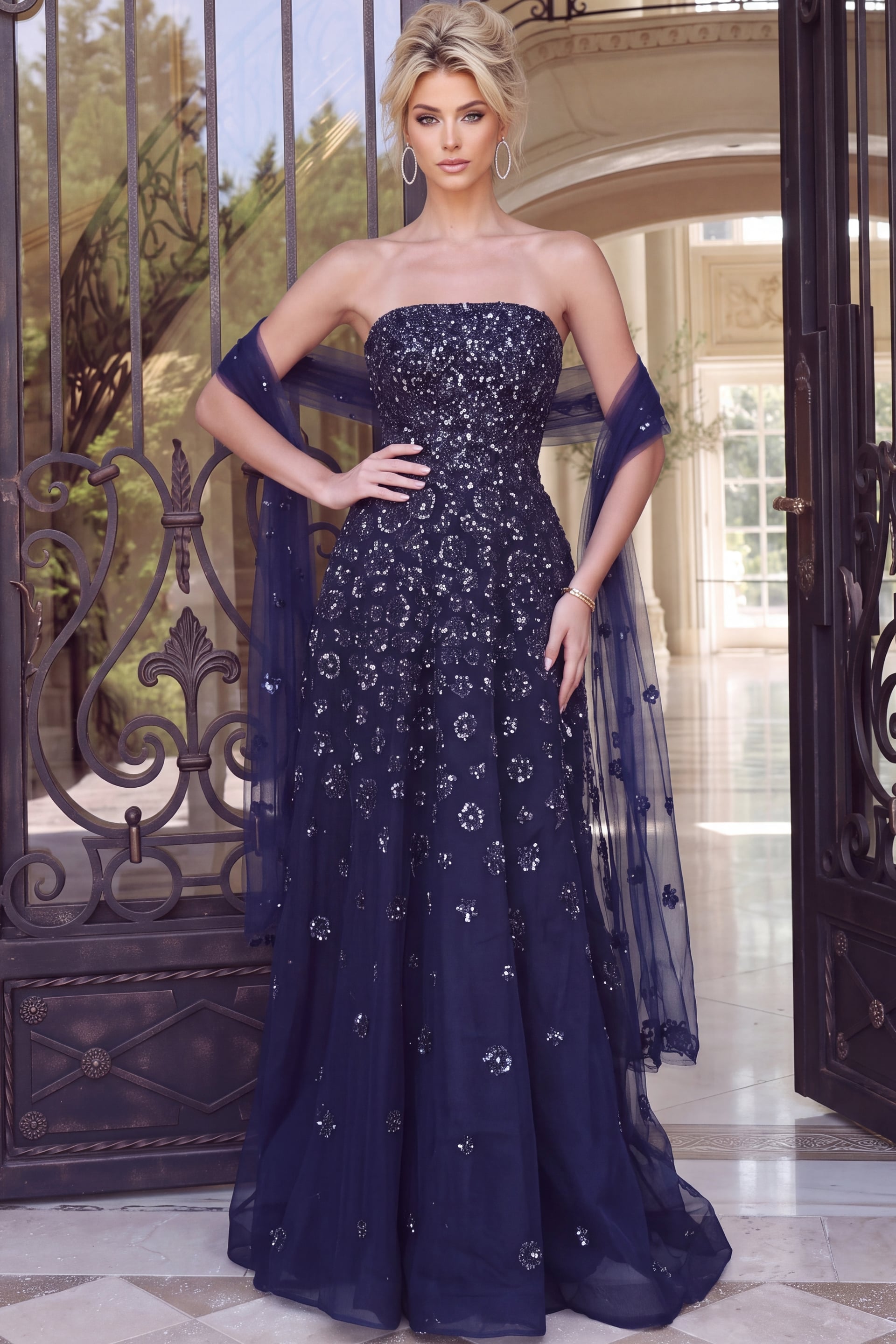 Navy beaded tulle gown with straight strapless neckline, flared skirt and sheer matching wrap