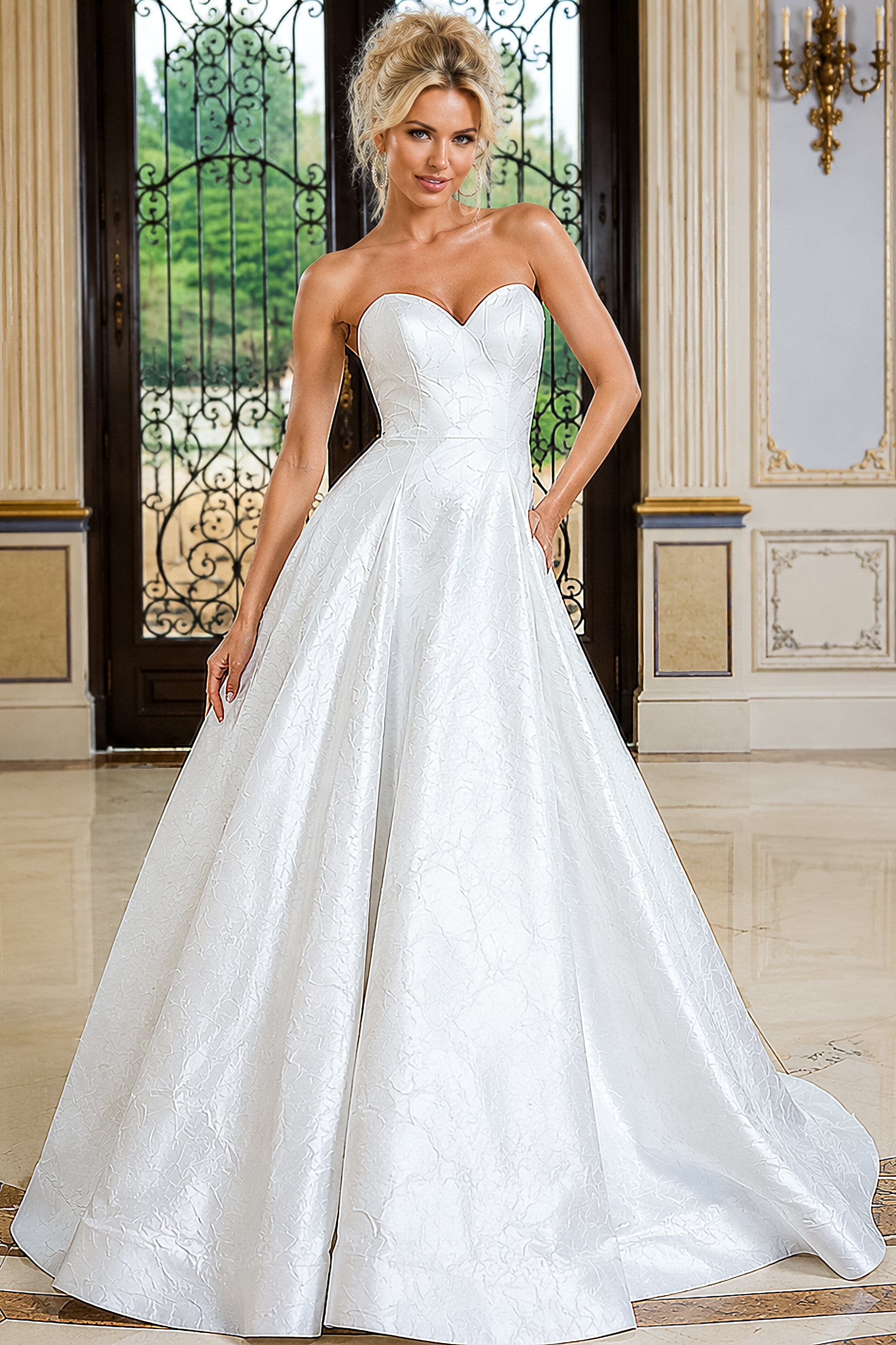 Model wearing a white strapless ball gown with a sweetheart neckline, structured corset bodice, and voluminous full skirt with subtle textured jacquard detailing.