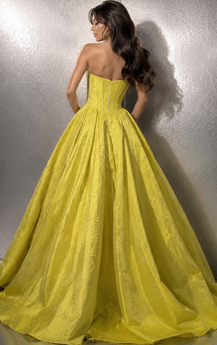 back view of yellow jacquard strapless ball gown