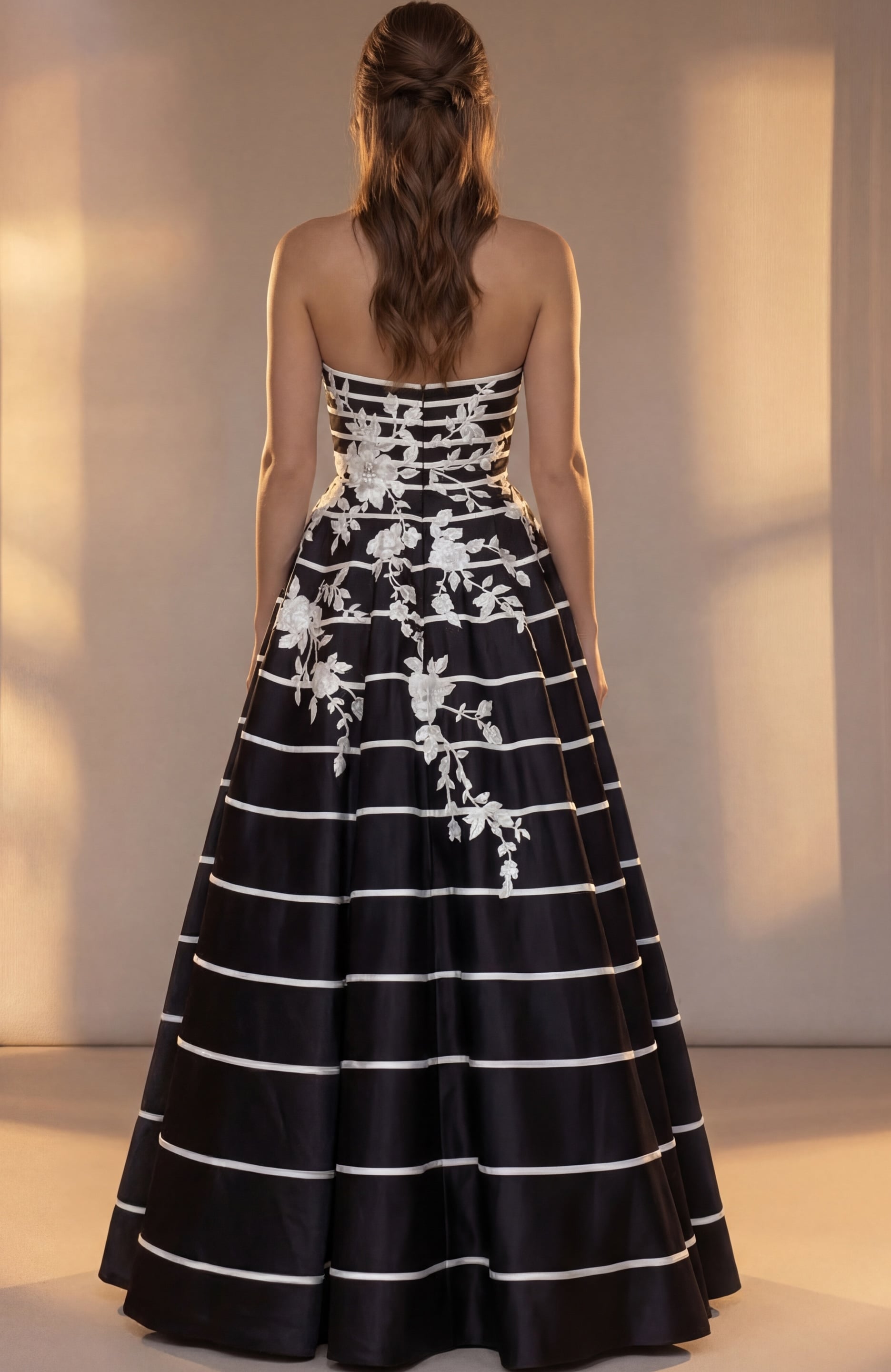 Back view of black and white striped taffeta ball gown showing zip back and full skirt