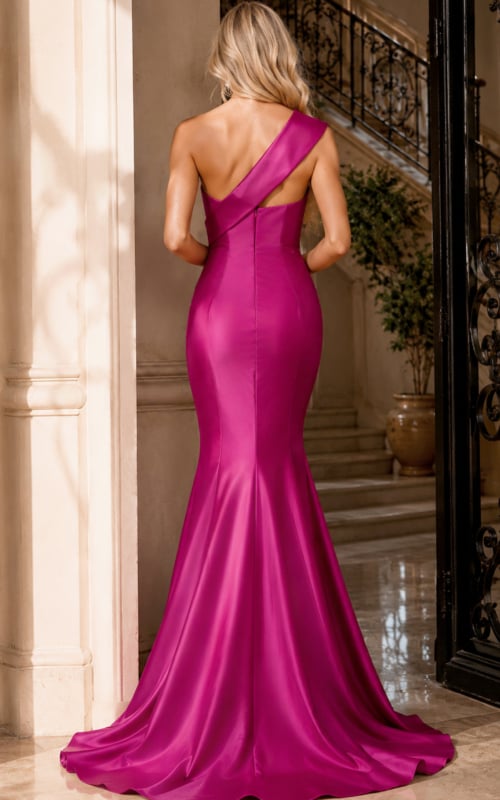 Narrow keyhole and long fishtail train on a magenta satin one-shoulder gown, viewed from behind