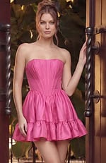 Vibrant fuchsia strapless mini dress featuring structured bodice pleating and a playful tiered ruffle skirt.