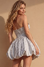 Fit-and-flare silhouette in a textured silver weave with a straight-cut back and a visible zipper closure.