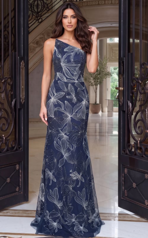 One-shoulder navy gown in silver-embroidered tulle, fitted through the hips to a train