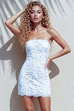 back view of white lace strapless mini dress with lace up corset back