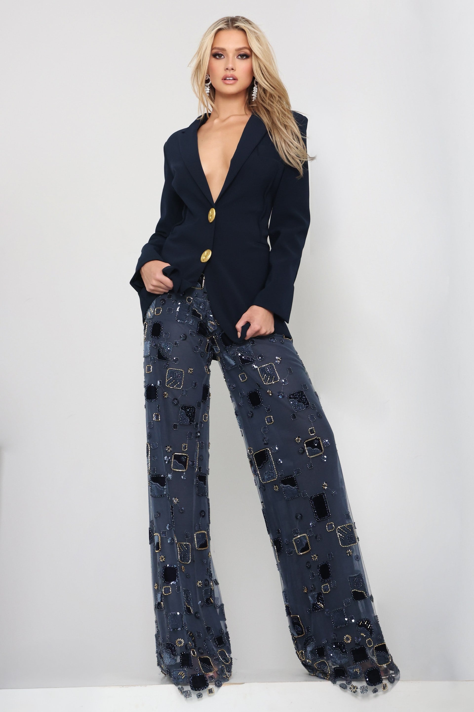 52096_Navy_1 Jovani style 52096 navy beaded blazer jumpsuit with plunging neckline, gold buttons and sheer embellished wide leg pants, front view