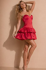 Sophisticated party attire blending a sleek, tailored top with a bold and whimsical tiered balloon-style hem.