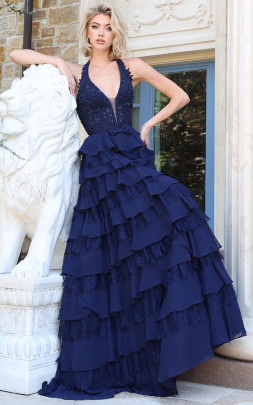 Navy beaded halter gown with plunging neckline and tiered ruffle chiffon skirt, front view