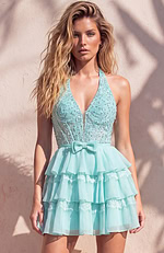 Bright turquoise party attire featuring a sleeveless halter top and a high-volume, triple-tiered ruffle hem.