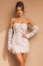 Ivory cocktail dress with a straight-across neckline and a high-texture floral finish, paired with coordinating fingerless lace arm covers.