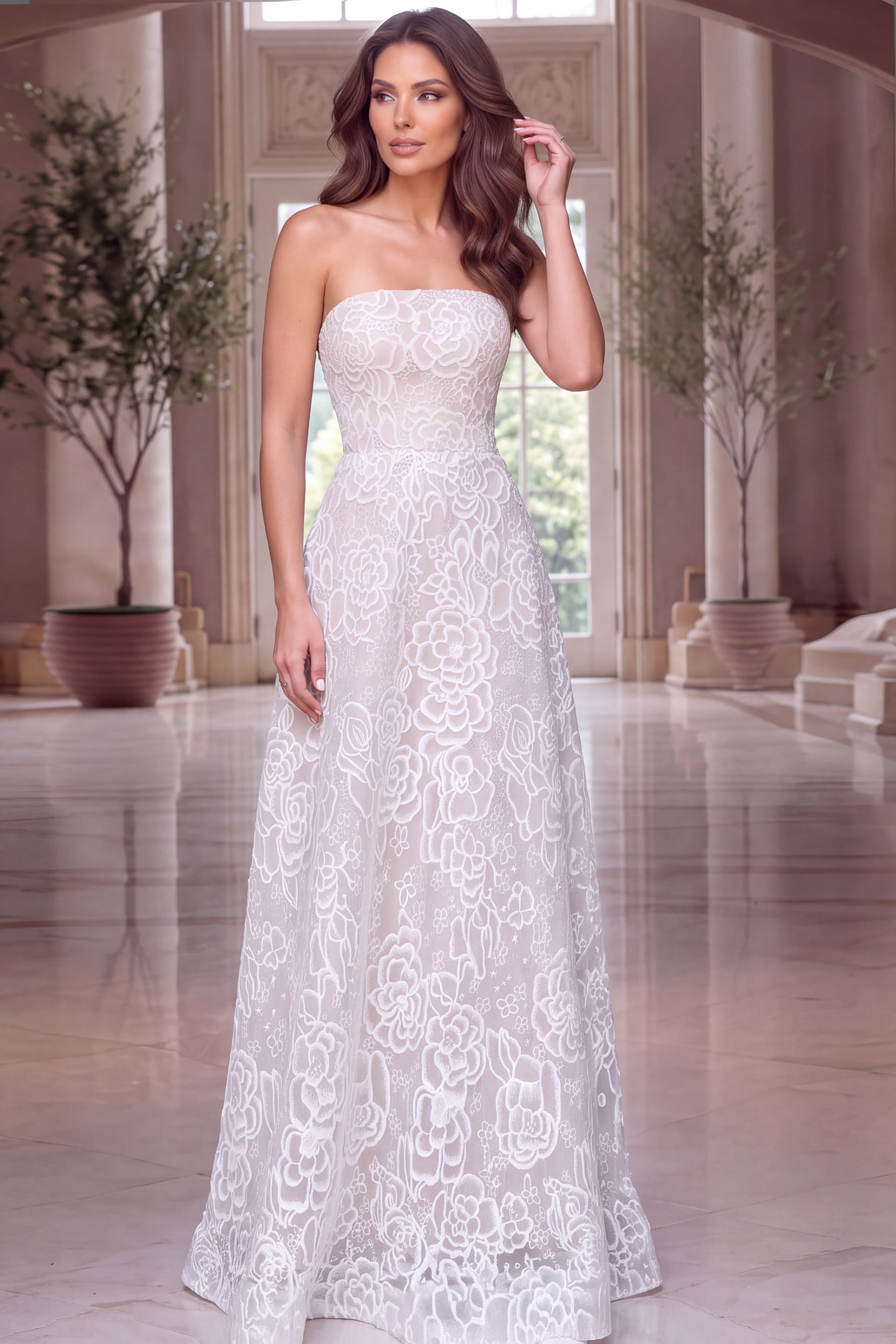 Strapless ball gown layered in ivory rose embroidery over blush tulle with straight neckline