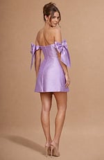 Satin mini dress with a straight off-the-shoulder neckline and oversized decorative bows on the arm straps.