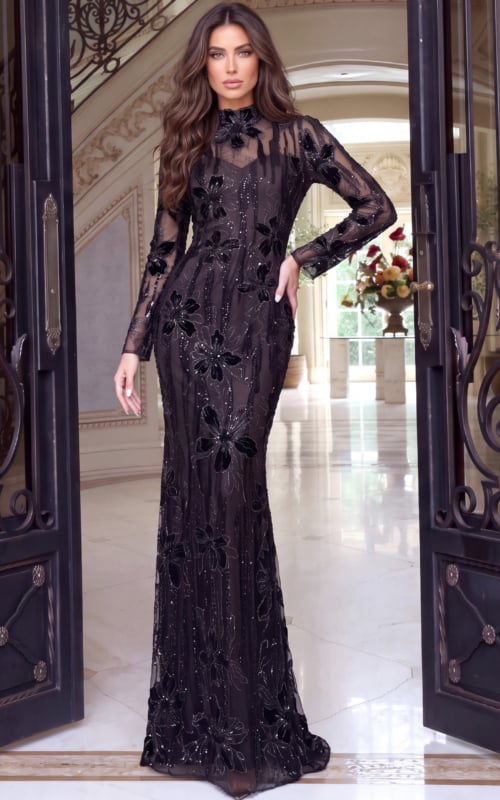 Floor-length black gown covered in velvet flowers, sheer sleeves and mock neckline