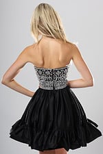 back view of black and silver beaded corset short homecoming dress with straight neckline and tiered ruffle skirt, Jovani style 52439