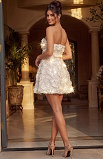 Short bridal-white cocktail dress with a sculptural silhouette and light-reflecting gemstone details at the heart of each 3D flower.