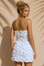 back view of white 3D floral strapless mini dress