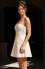 Elegant strapless mini dress with a hidden back zipper and a seamless pattern of oversized roses for a romantic aesthetic.