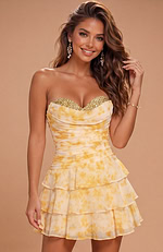 Feminine party dress with a three-tiered flounce skirt and a body-hugging ruched bodice in a soft watercolor pattern.