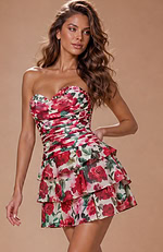 Sophisticated strapless attire blending a structured ruched fit with soft, tiered chiffon-style layers for a garden-ready look.
