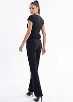 Modern black evening jumpsuit with statement bow waist