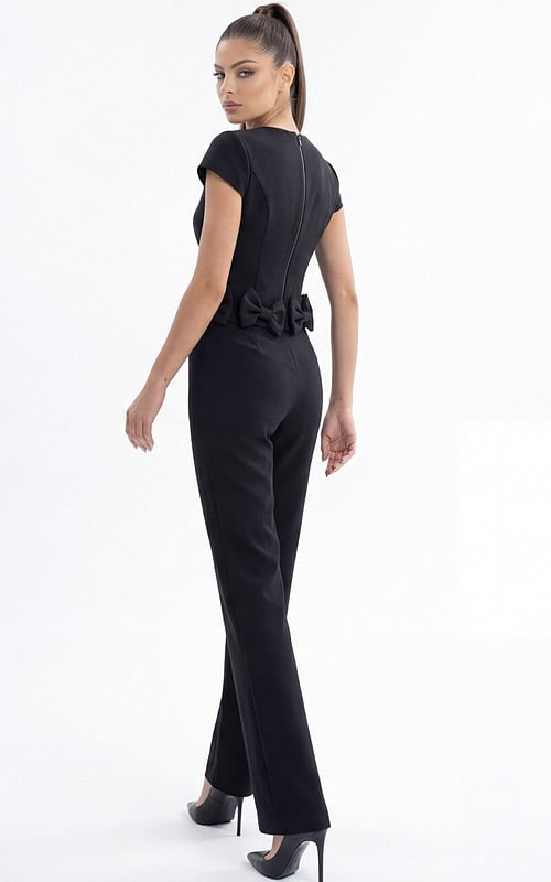 Modern black evening jumpsuit with statement bow waist