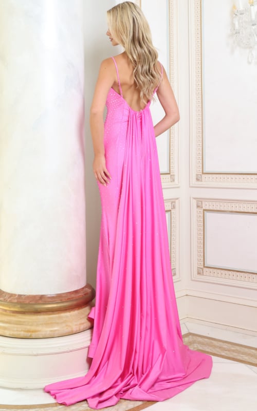 Back view of hot pink jersey gown showing low open back and flowing panel train