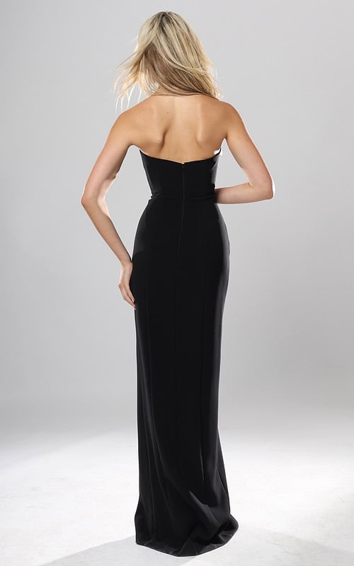 back view of black crepe strapless fitted long gown with rhinestone rose applique and high slit, Jovani style 53108