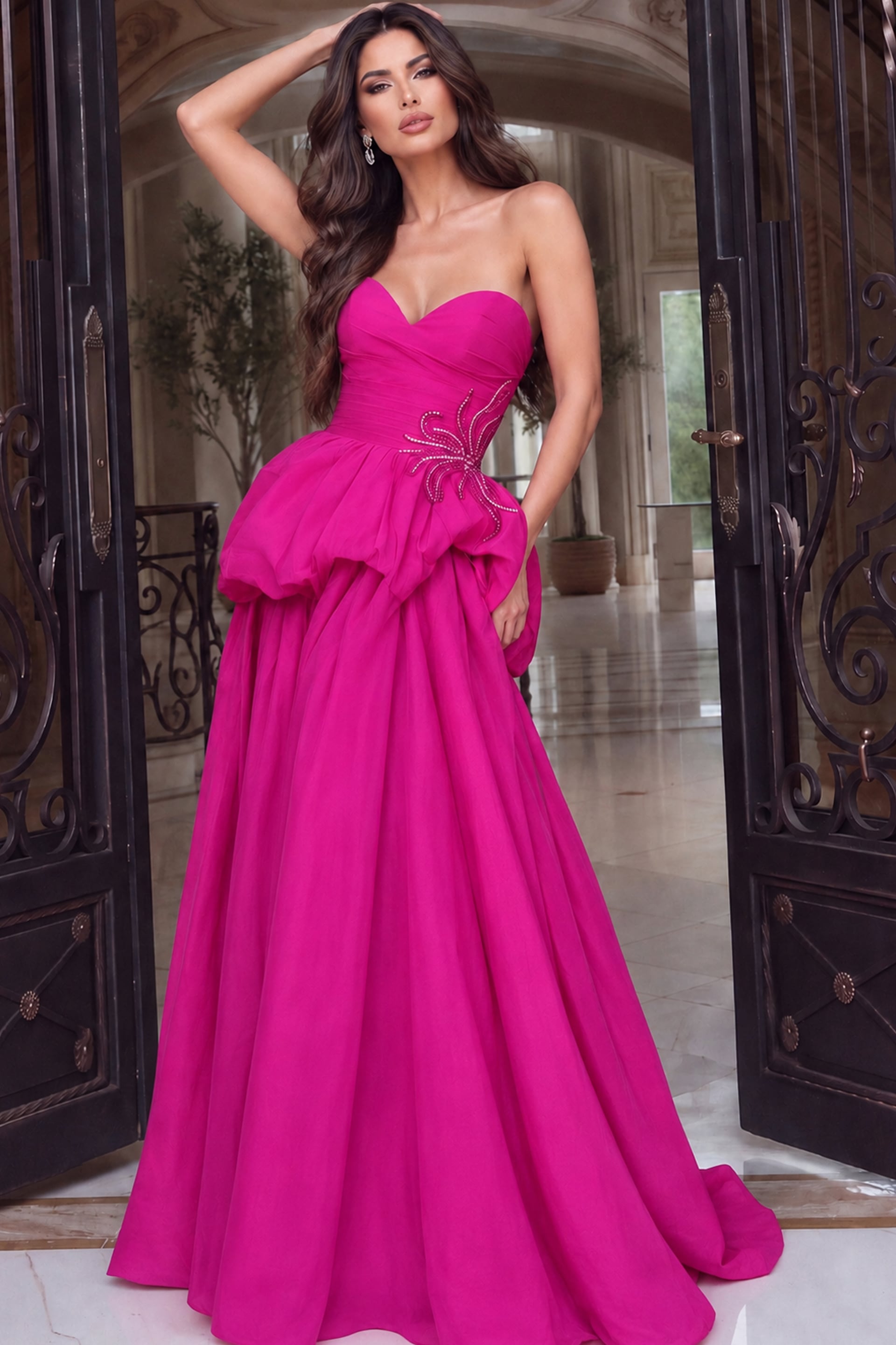Fuchsia strapless gown with ruched sweetheart bodice, beaded waist motif and bubble peplum overskirt