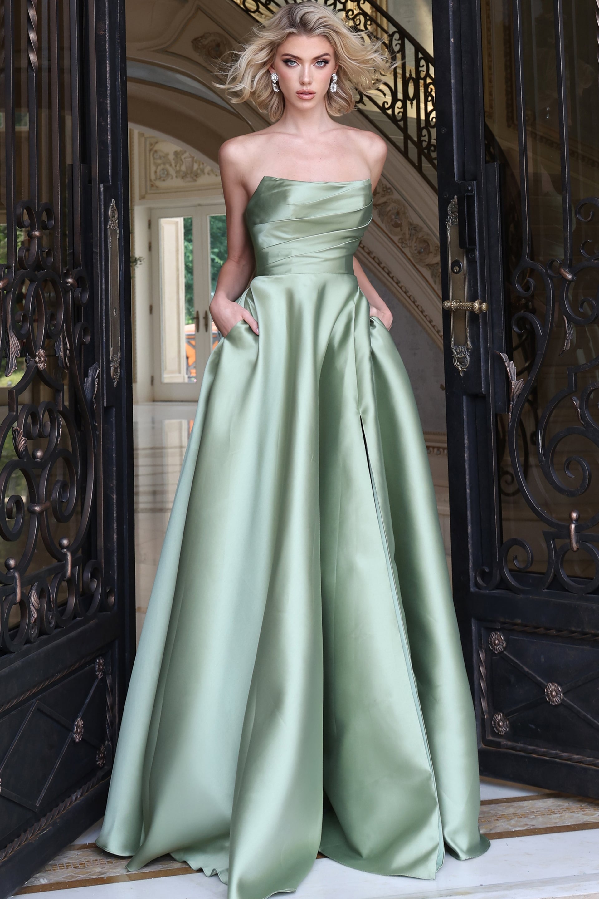 Sage satin strapless gown showing side pockets and full pleated skirt