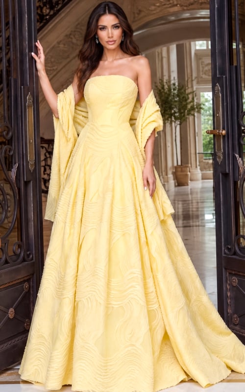 Strapless pastel yellow ball gown with a sculpted bodice and wide skirt held by a stole