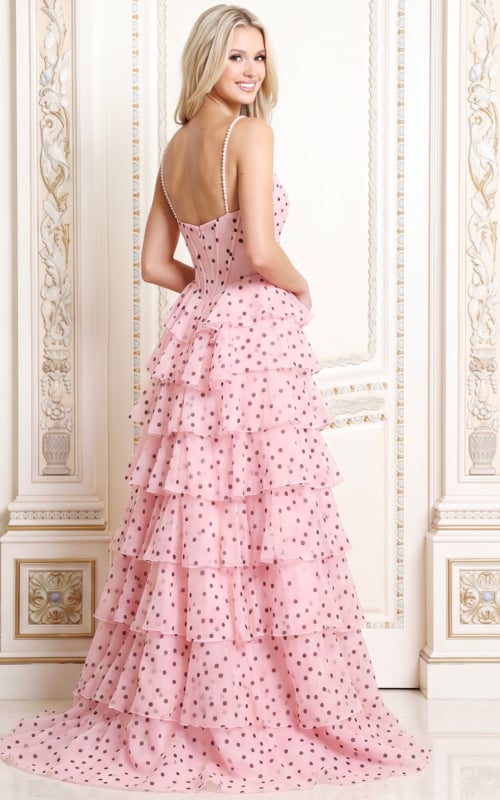 Back view of pink polka dot tulle ball gown showing the corset back and tiered skirt