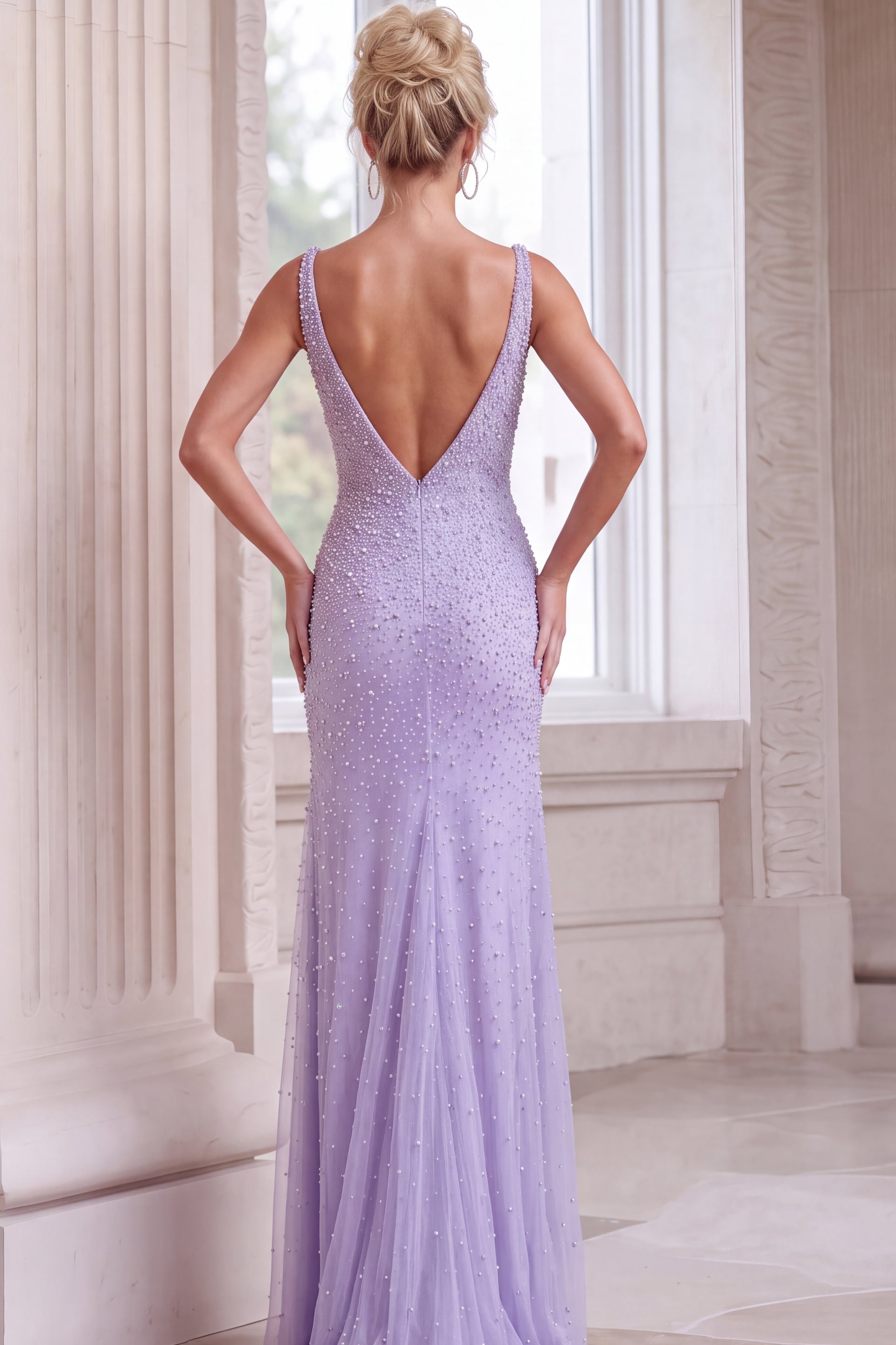 Lilac floor-length formal gown with all-over crystal beadwork and plunging V-back.