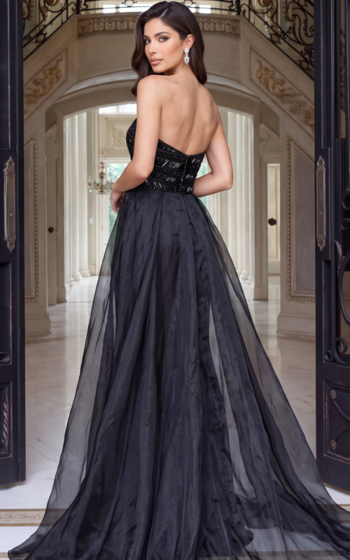 Back of a strapless black beaded gown layered under a sheer organza overskirt