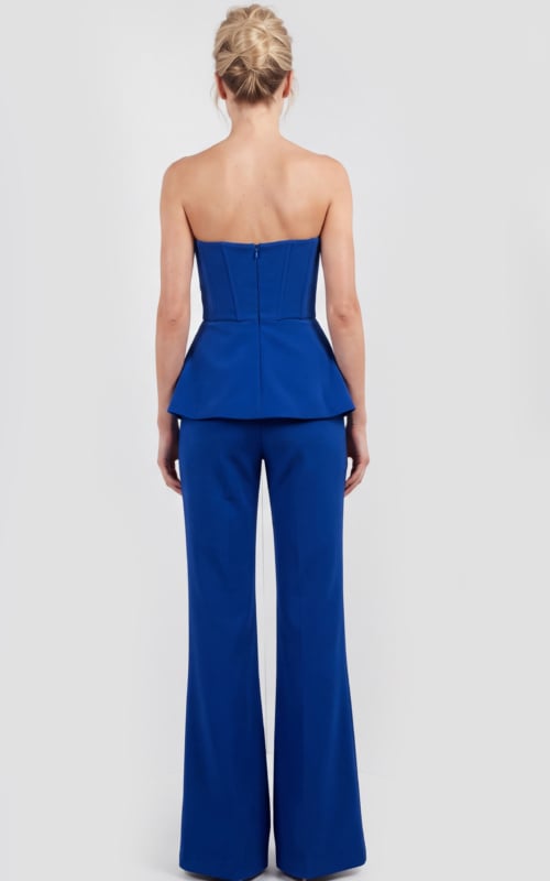 Blue sleeveless pantsuit with structured neckline and dramatic flare pants.