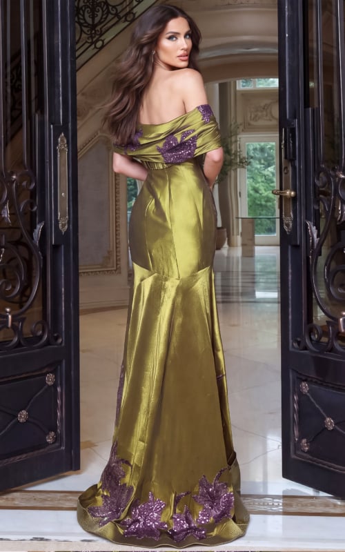 Turned to show the back of an olive satin mermaid gown with draped shoulder band and sequin hem