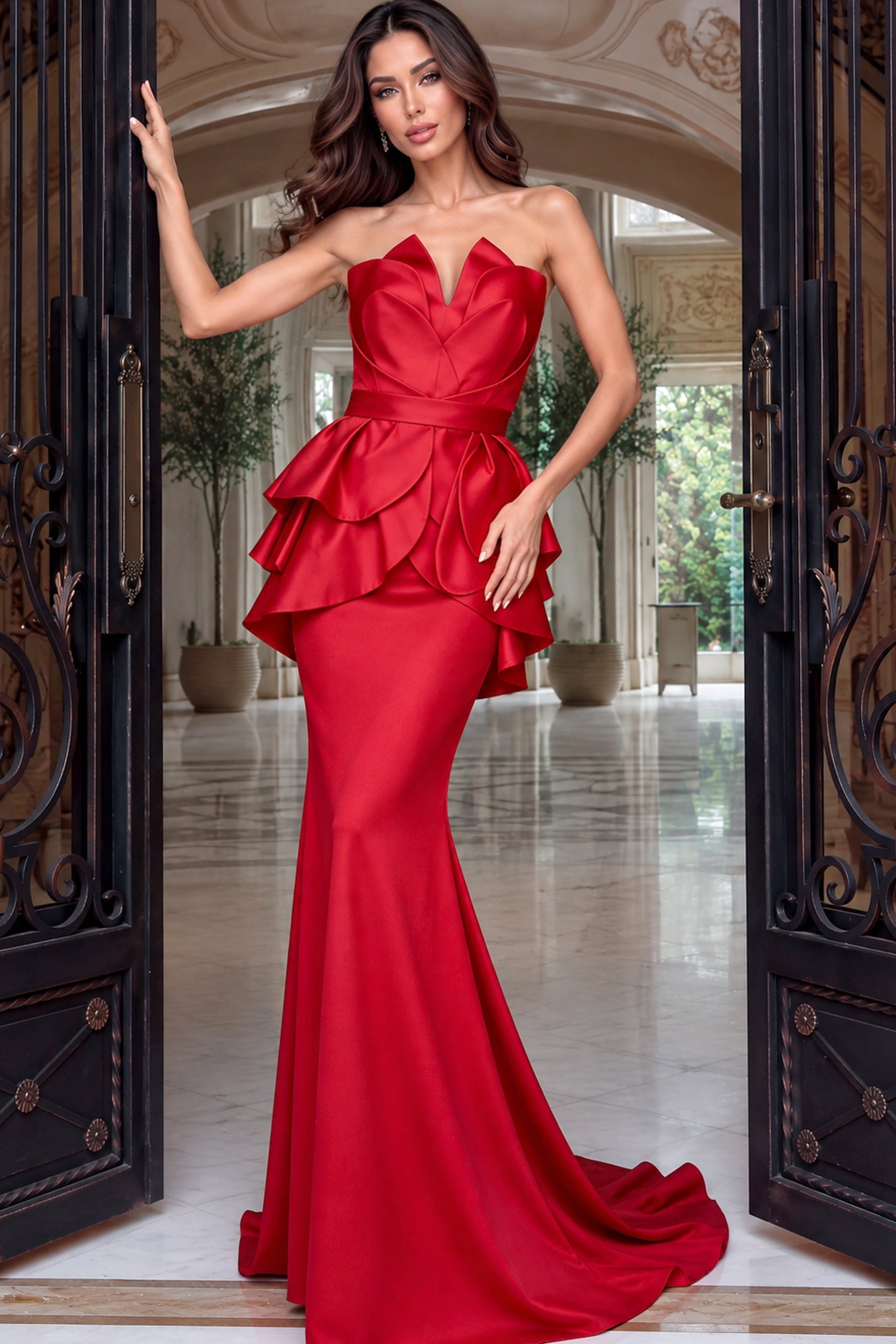 Scarlet strapless gown with folded petal bodice, double ruffle peplum and long sweeping train