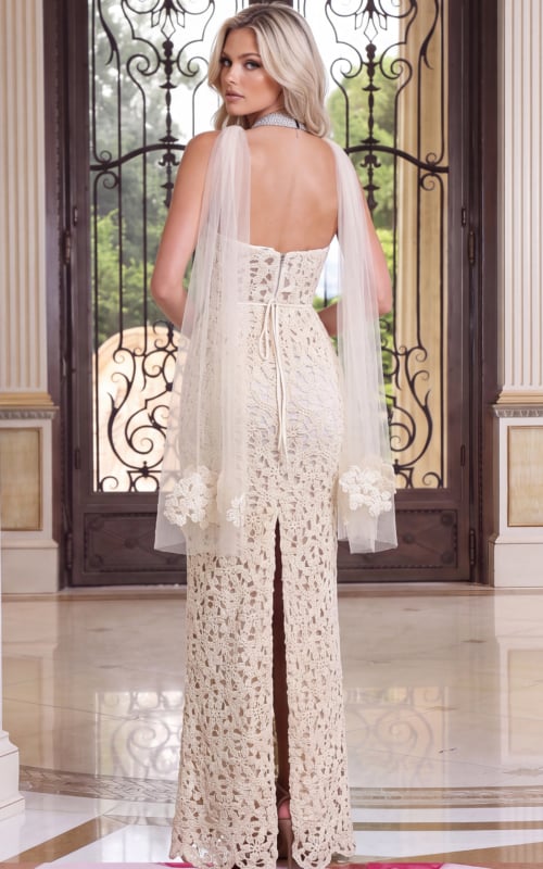 Back view of ivory crochet gown with flowing sheer sleeves