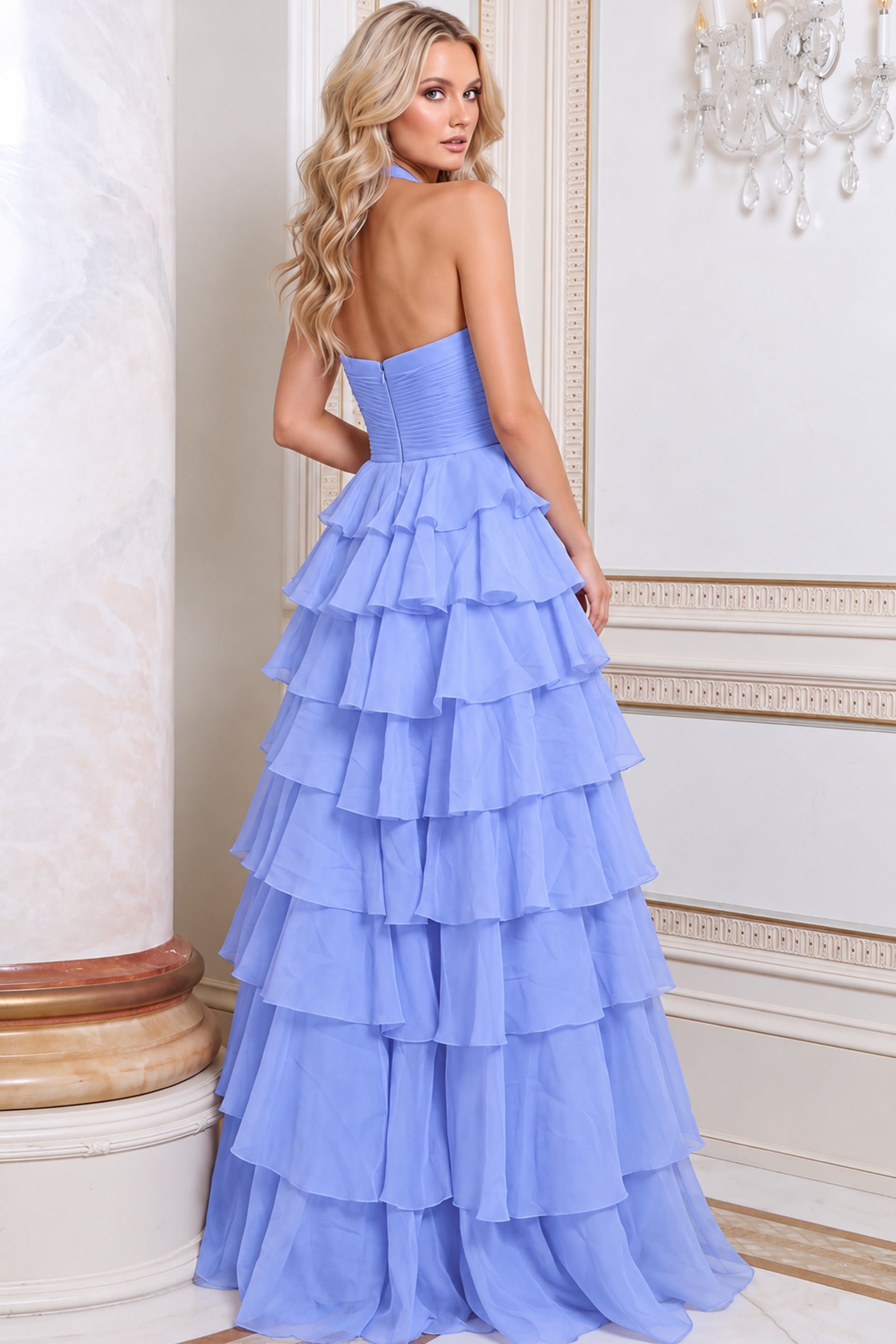 Back view of periwinkle chiffon gown showing halter back and tiered ruffle skirt