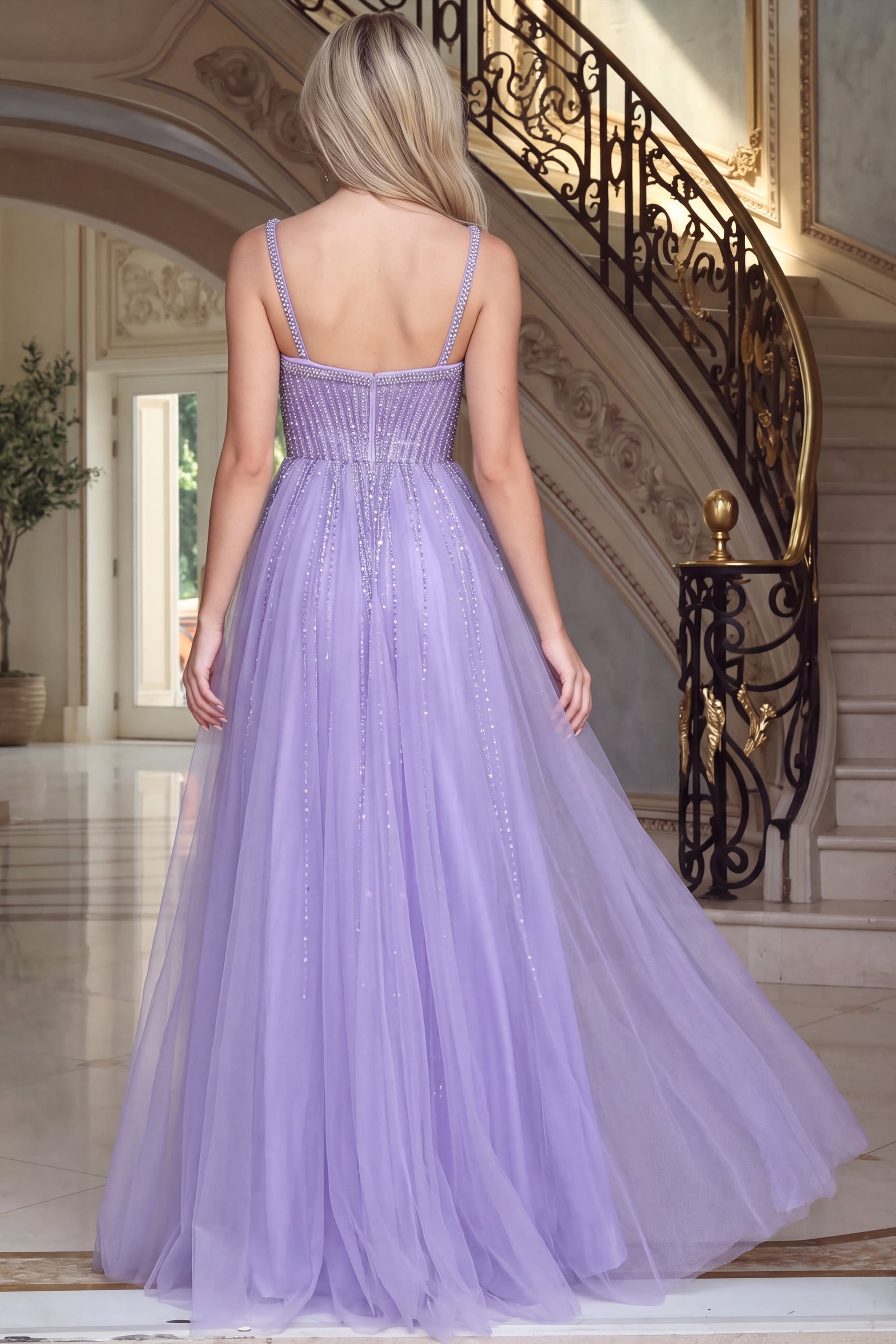 Back view of lilac beaded tulle ball gown showing the corset back and full tulle skirt