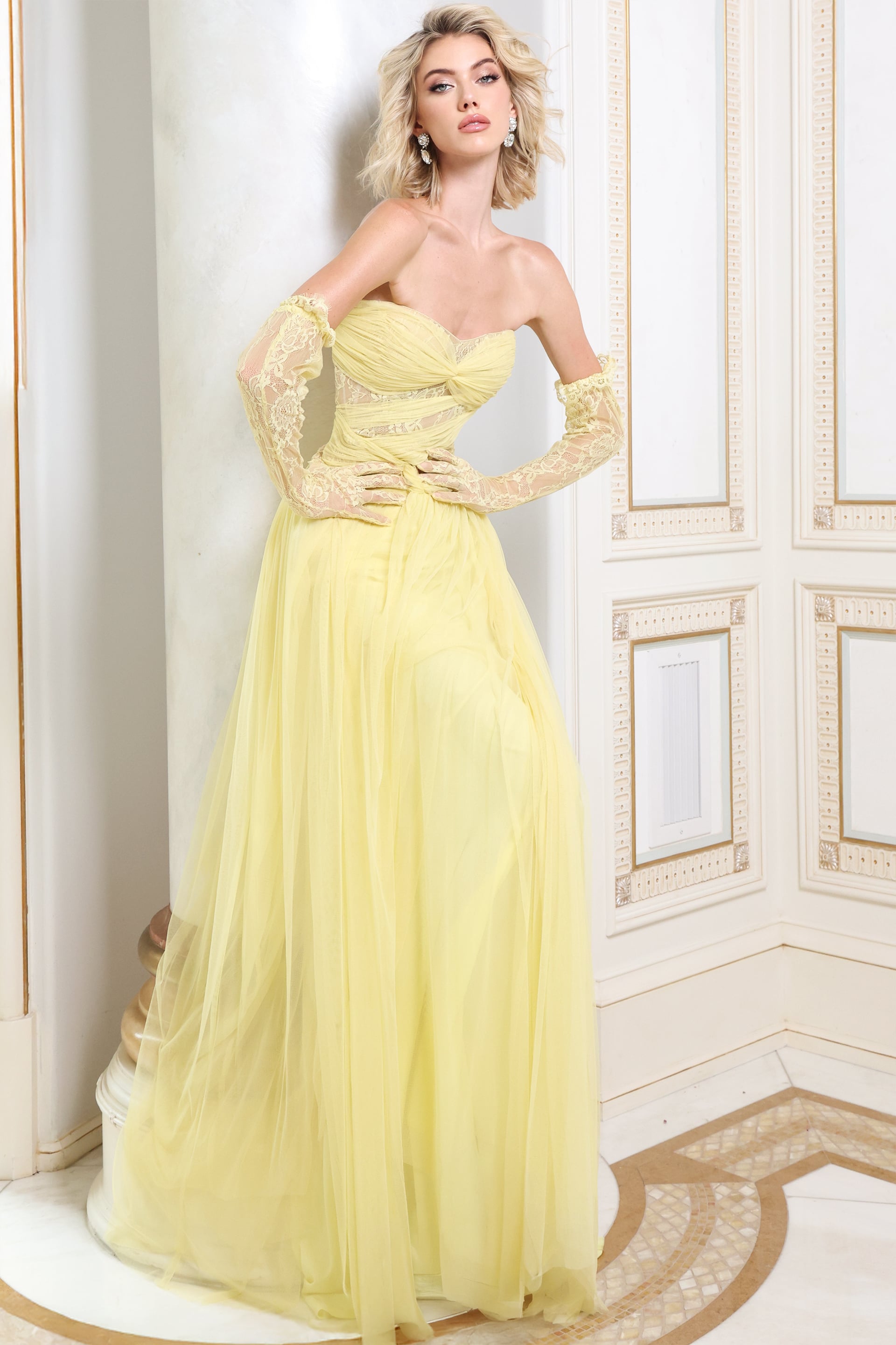 Butter yellow tulle gown with matching lace gloves shown full length, front view