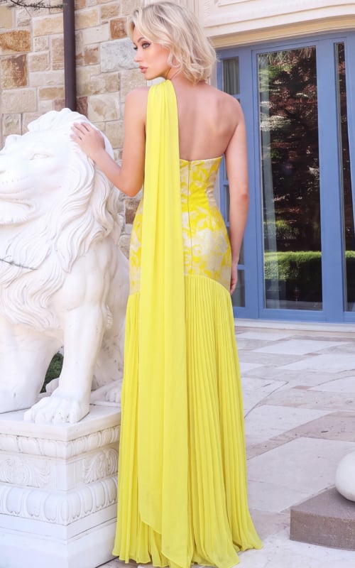 Bright yellow evening dress with flowing scarf detail