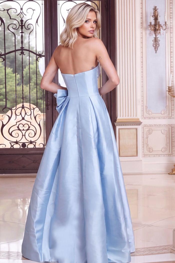 Seamed corset back, zipper and side bow on a light blue strapless gown, rear view