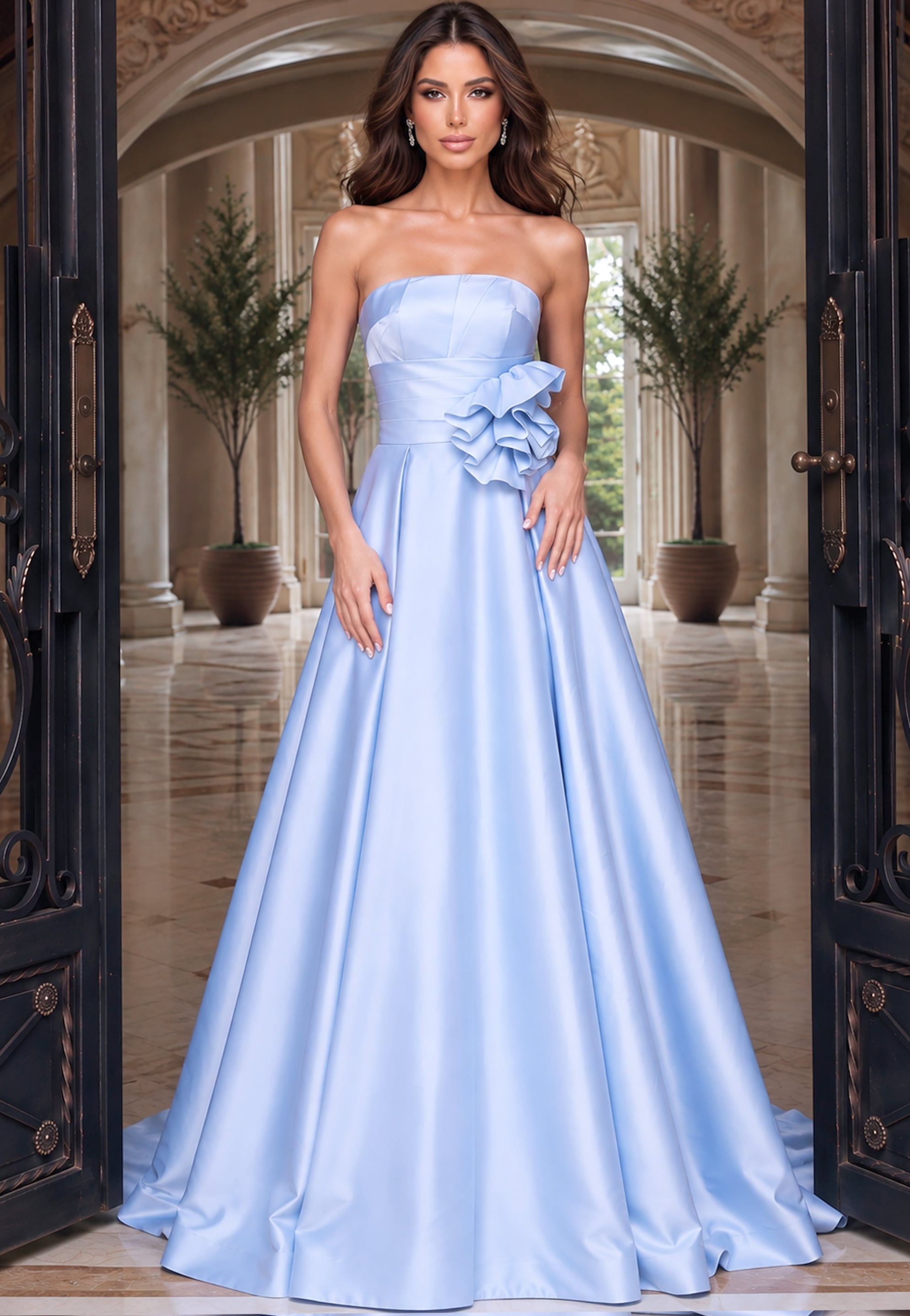 Powder blue strapless ball gown with rosette waist detail and wide skirt spreading into a train