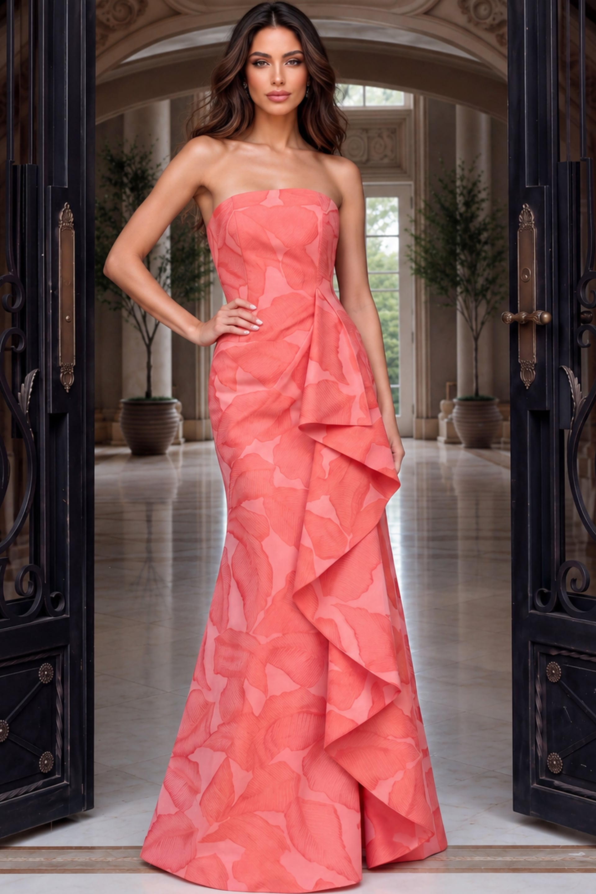 Vivid orange-coral jacquard gown with a straight strapless bodice and dramatic side ruffle