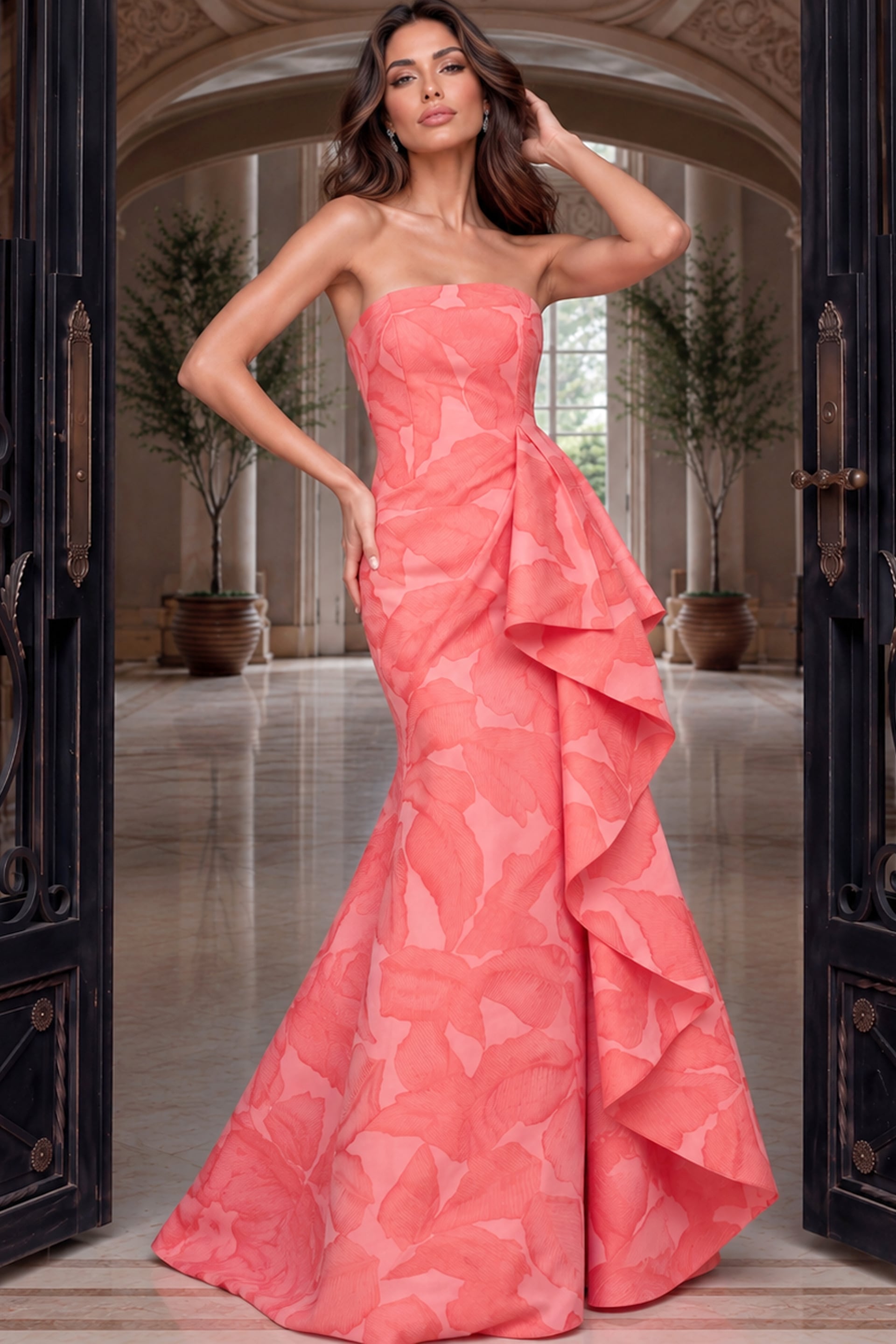 Soft coral-pink jacquard gown with strapless neckline and a large ruffle cascading sideways